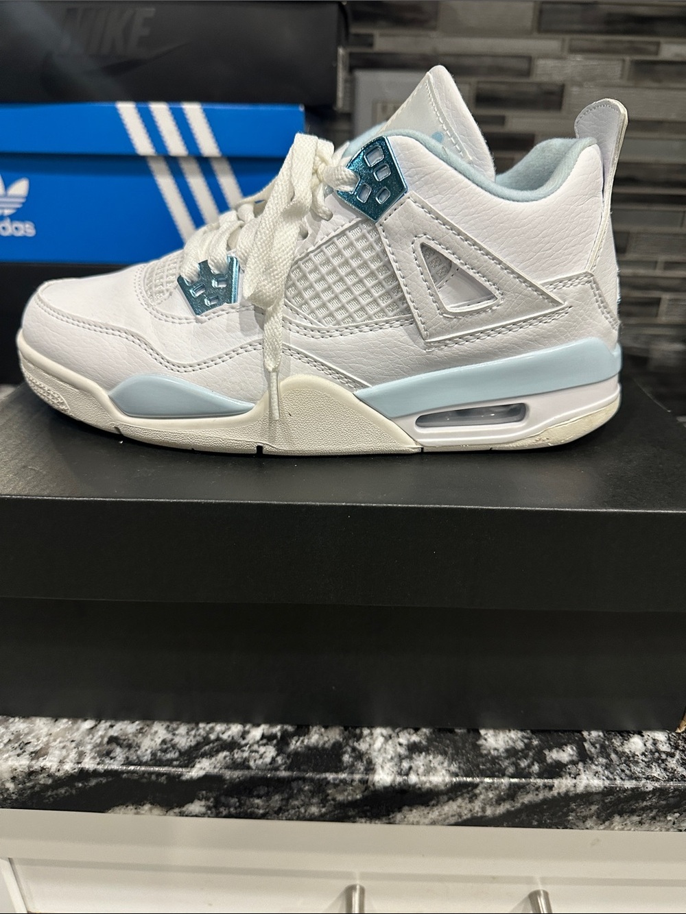 Girls Jordan 4’s Light blue and White